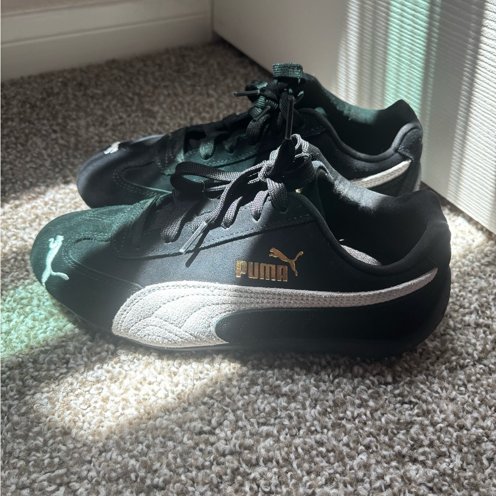 Puma Black Sneakers with Gold and White Accents